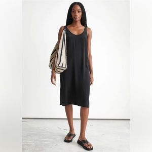 Sleeveless black silk slip dress